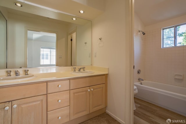 981 Asilomar Ter Unit 1, Sunnyvale, CA 94086 - bathroom featuring double vanity, shower / washtub combination, recessed lighting, and wood finished floors