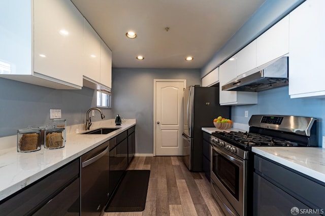 981 Asilomar Ter Unit 1, Sunnyvale, CA 94086 - kitchen with stainless steel appliances, under cabinet range hood, white cabinetry, modern cabinets, and recessed lighting
