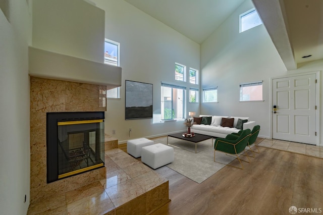 981 Asilomar Ter Unit 1, Sunnyvale, CA 94086 - living room with high vaulted ceiling, wood finished floors, and a tile fireplace