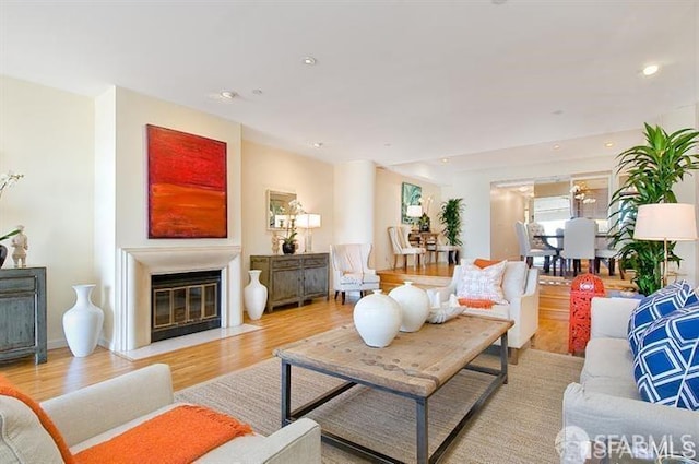 2040 Broadway St Unit 102, San Francisco, CA 94115 - living area featuring light wood finished floors, a fireplace with flush hearth, and recessed lighting