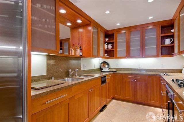 2040 Broadway St Unit 102, San Francisco, CA 94115 - kitchen featuring high end fridge, light stone counters, recessed lighting, open shelves, and brown cabinetry