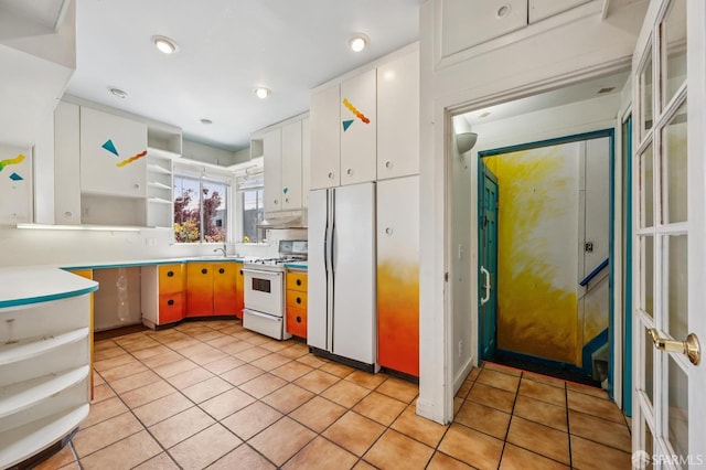 80 Bronte St, San Francisco, CA 94110 - kitchen featuring white appliances, open shelves, under cabinet range hood, and light tile patterned floors