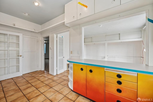 80 Bronte St, San Francisco, CA 94110 - kitchen featuring light tile patterned flooring, light countertops, and open shelves