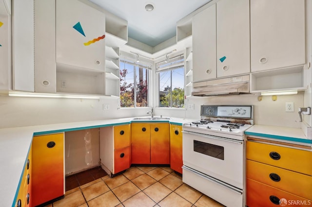 80 Bronte St, San Francisco, CA 94110 - kitchen featuring gas range gas stove, open shelves, under cabinet range hood, and light countertops
