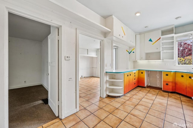 80 Bronte St, San Francisco, CA 94110 - kitchen featuring open shelves, light countertops, white cabinets, and light tile patterned flooring