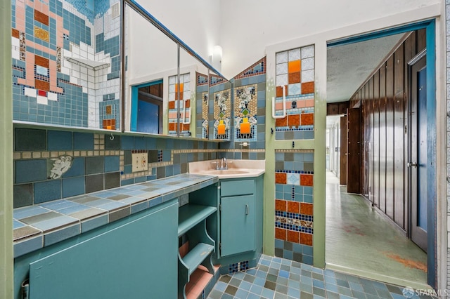80 Bronte St, San Francisco, CA 94110 - bathroom with vanity, tile patterned flooring, and backsplash