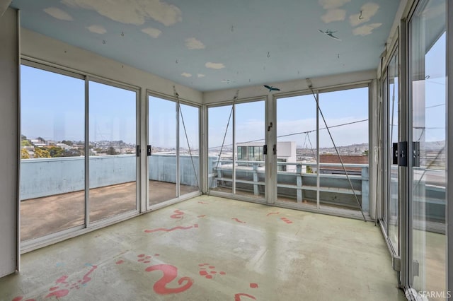 80 Bronte St, San Francisco, CA 94110 - unfurnished sunroom with unfinished concrete flooring and plenty of natural light