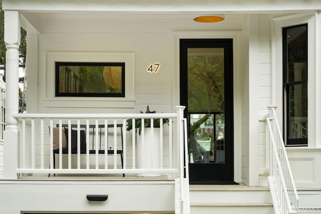 entrance to property with covered porch