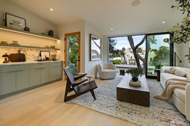 living area with recessed lighting and light wood-type flooring