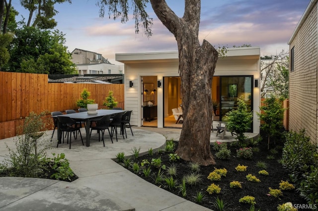 view of patio with fence and outdoor dining space