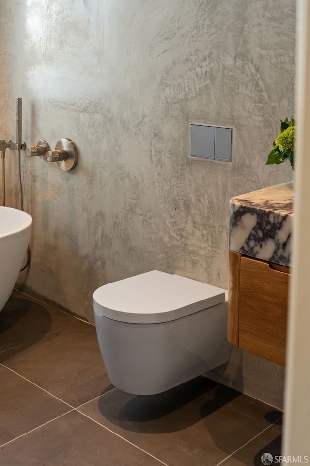bathroom featuring toilet and tile patterned floors