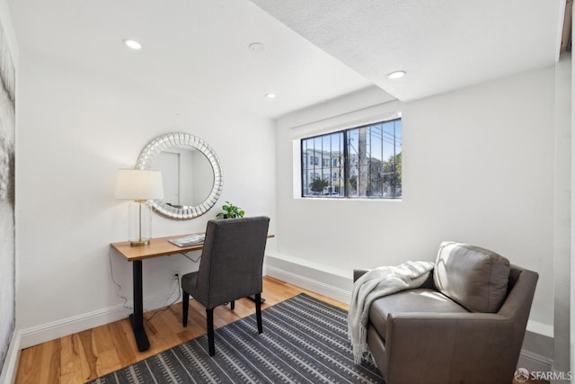 office space with recessed lighting, wood finished floors, and baseboards