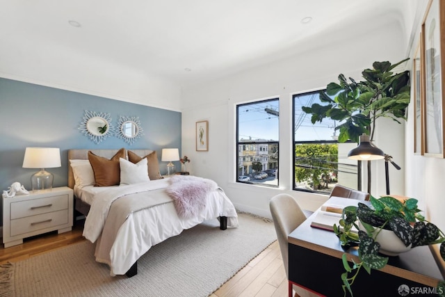 bedroom with light wood-style floors