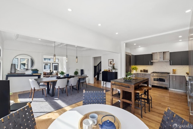 dining room featuring recessed lighting and light wood-style floors