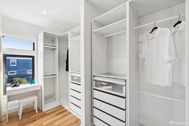 spacious closet featuring light wood-type flooring