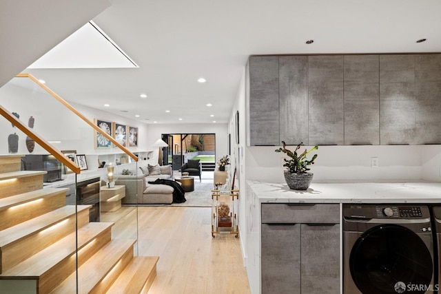 interior space featuring washer / clothes dryer and light hardwood / wood-style floors