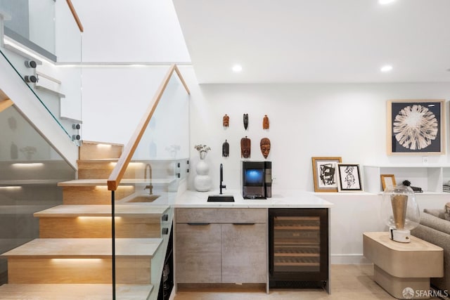 bar featuring beverage cooler and sink