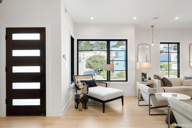 sitting room with light hardwood / wood-style floors