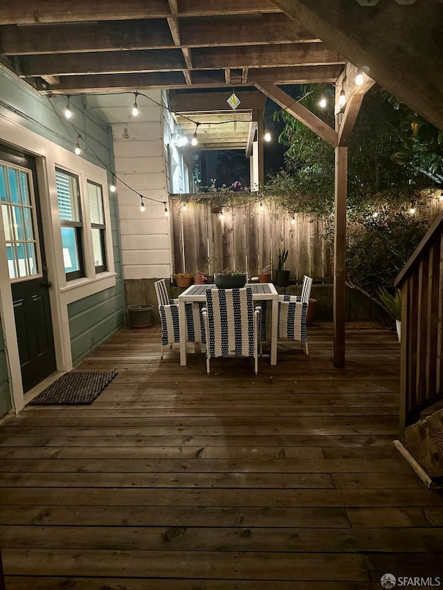 wooden deck featuring fence and outdoor dining space