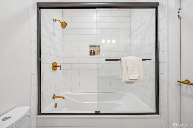 bathroom with toilet and shower / bath combination