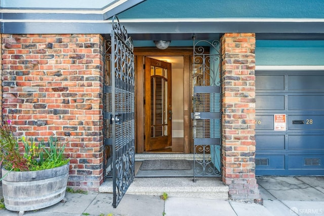 property entrance featuring brick siding