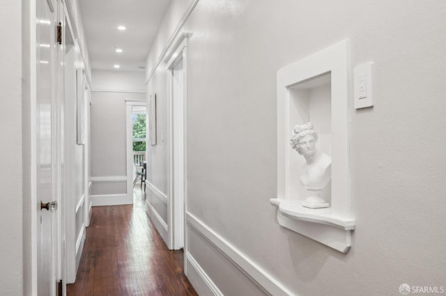 hall with recessed lighting, baseboards, and dark wood-style floors