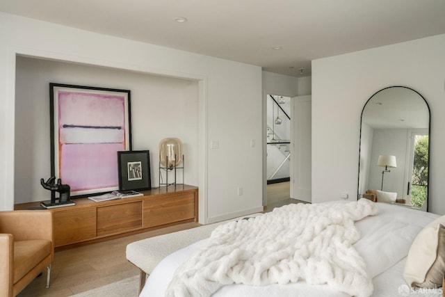 bedroom with light hardwood / wood-style floors