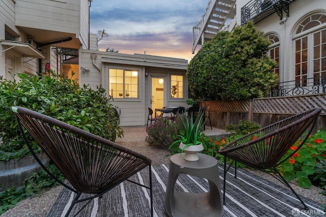 balcony at dusk with a patio