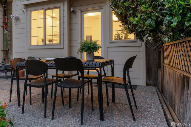 view of patio / terrace featuring outdoor dining area and fence