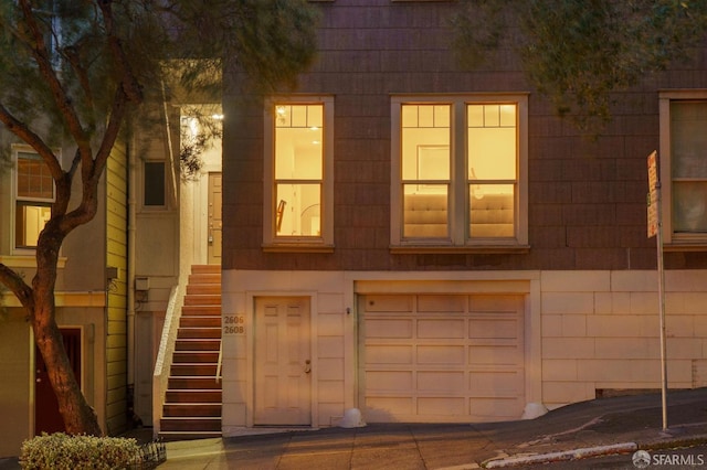 multi unit property featuring a garage
