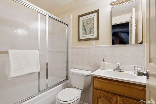 1874 34th Ave, San Francisco, CA 94122 - bathroom featuring vanity, enclosed tub / shower combo, and tile walls