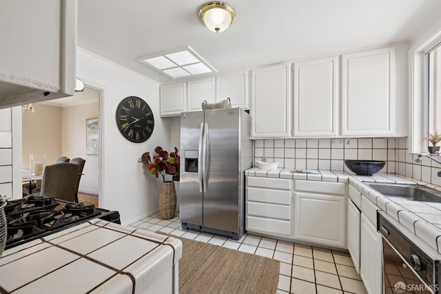 1874 34th Ave, San Francisco, CA 94122 - kitchen featuring stainless steel fridge, tile countertops, black dishwasher, white cabinets, and tasteful backsplash