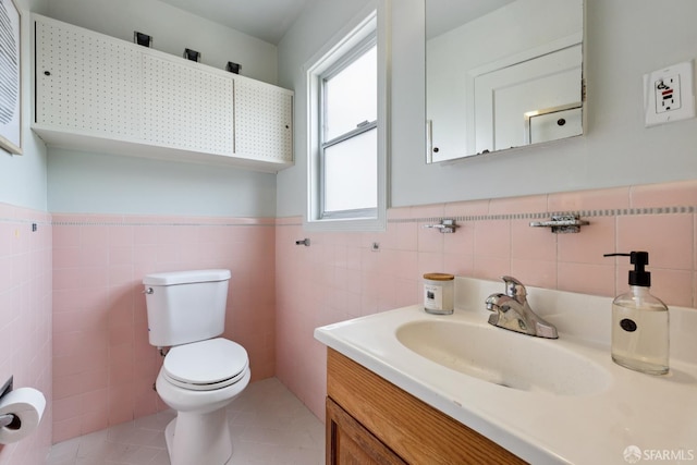 1874 34th Ave, San Francisco, CA 94122 - half bath with tile walls, vanity, a wainscoted wall, and tile patterned floors