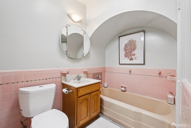 1874 34th Ave, San Francisco, CA 94122 - bathroom with tile walls, a garden tub, vanity, and wainscoting