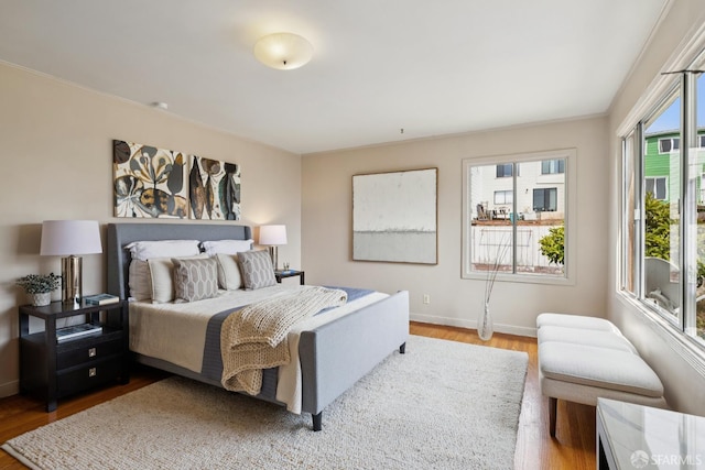 1874 34th Ave, San Francisco, CA 94122 - bedroom with multiple windows and wood finished floors