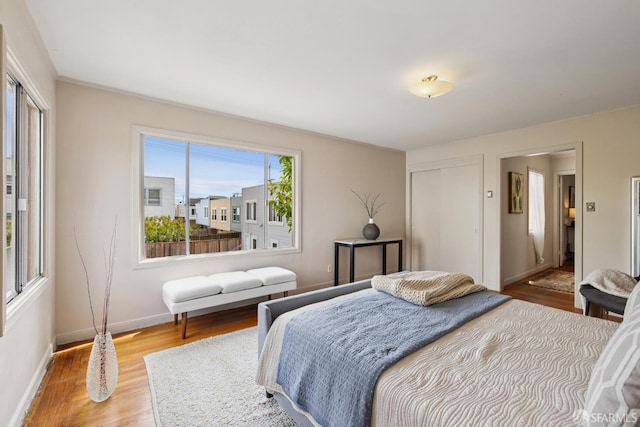 1874 34th Ave, San Francisco, CA 94122 - bedroom featuring wood finished floors and a closet