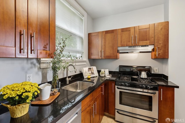 1250 Vallejo St Unit 9, San Francisco, CA 94109 - kitchen with stainless steel appliances, under cabinet range hood, and dark stone countertops