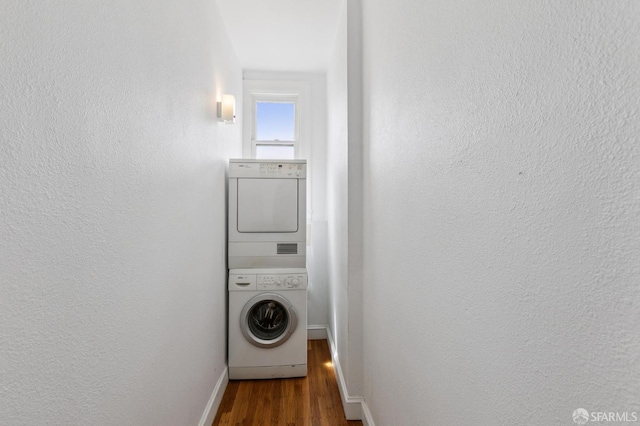 1250 Vallejo St Unit 9, San Francisco, CA 94109 - washroom with estacked washer and dryer, wood finished floors, and a textured wall