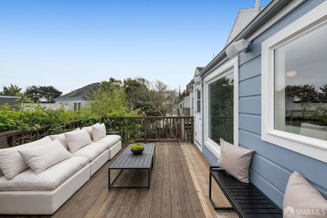 wooden deck with outdoor lounge area