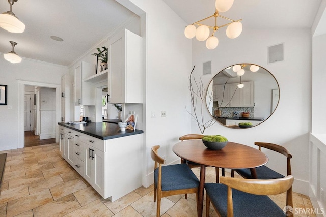 kitchen with visible vents, baseboards, dark countertops, white cabinetry, and open shelves