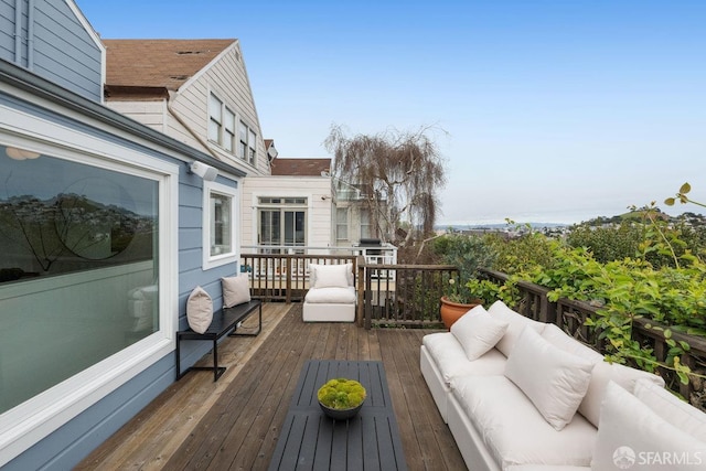 wooden deck featuring outdoor lounge area