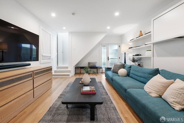 living room featuring light wood-type flooring and recessed lighting