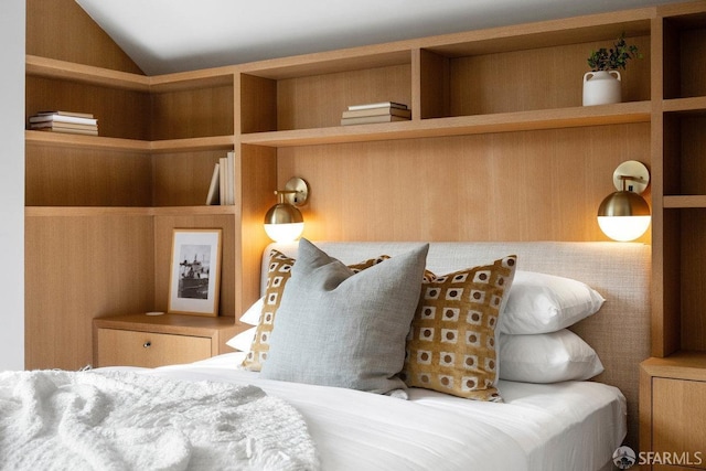 bedroom with lofted ceiling