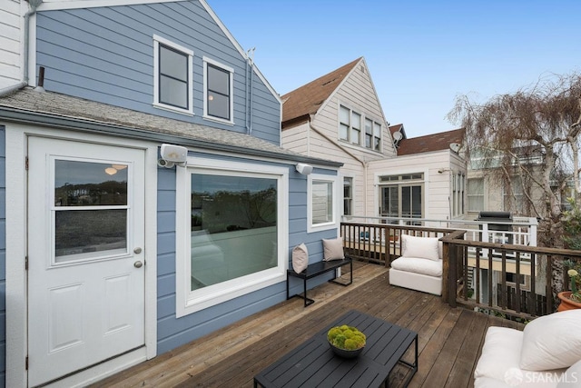 wooden terrace featuring a garage