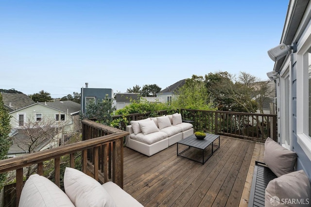 wooden deck with an outdoor hangout area