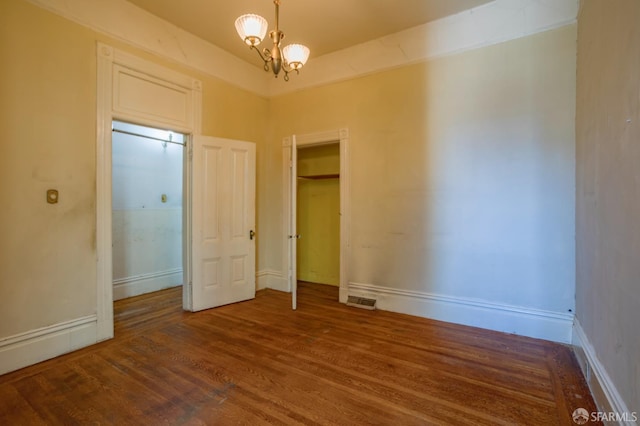 772-774 14th St, San Francisco, CA 94114 - unfurnished bedroom featuring wood finished floors, baseboards, and a chandelier
