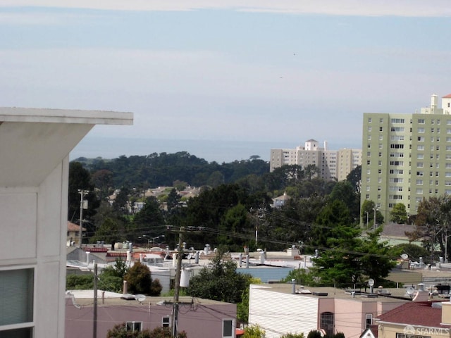 property's view of city featuring a water view