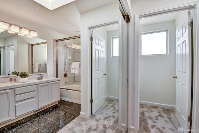 bathroom featuring shower / bathing tub combination, baseboards, and vanity