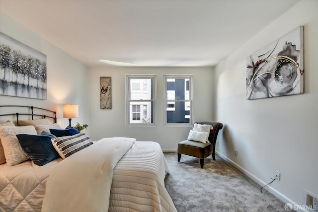 bedroom featuring visible vents, baseboards, and carpet floors