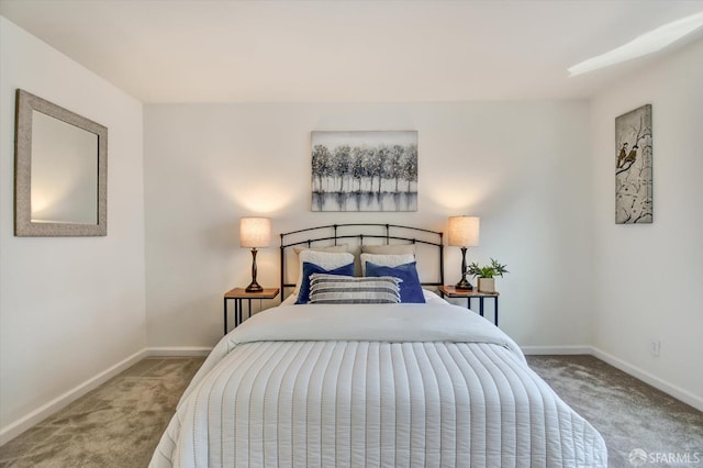 carpeted bedroom with baseboards